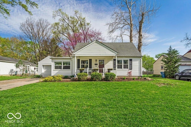 2204 Pamela Dr, Indianapolis, IN 46220 - bungalow with concrete driveway, a shingled roof, an attached garage, a porch, and a front yard
