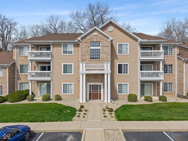 6516 Emerald Hill Ct Unit 310, Indianapolis, IN 46237 - view of property featuring uncovered parking