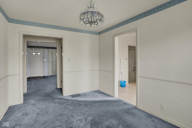 1194 S Faculty Dr, Indianapolis, IN 46241 - carpeted spare room with baseboards and a notable chandelier