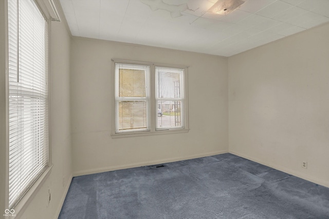 1194 S Faculty Dr, Indianapolis, IN 46241 - spare room featuring visible vents, baseboards, and dark colored carpet