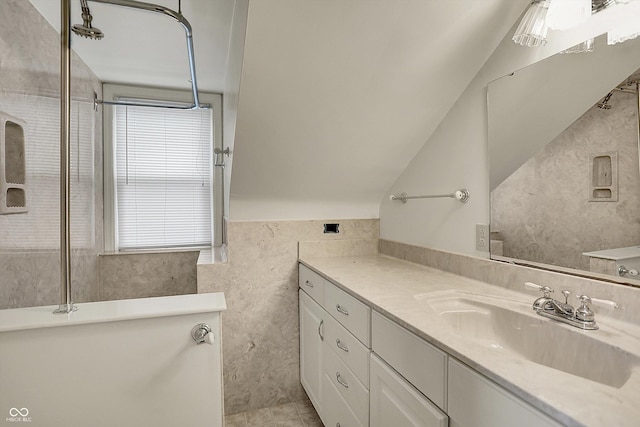 1194 S Faculty Dr, Indianapolis, IN 46241 - bathroom with a freestanding tub, vanity, and vaulted ceiling