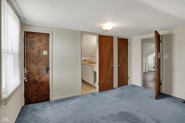 1194 S Faculty Dr, Indianapolis, IN 46241 - unfurnished bedroom featuring light colored carpet, baseboards, and connected bathroom