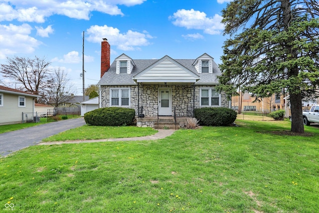 1194 S Faculty Dr, Indianapolis, IN 46241 - cape cod-style house featuring fence, a shingled roof, a front yard, and stone siding