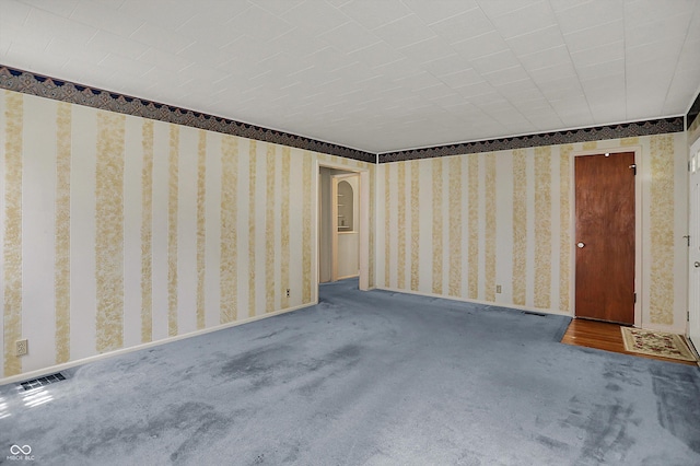 1194 S Faculty Dr, Indianapolis, IN 46241 - unfurnished room with visible vents, wallpapered walls, and carpet floors