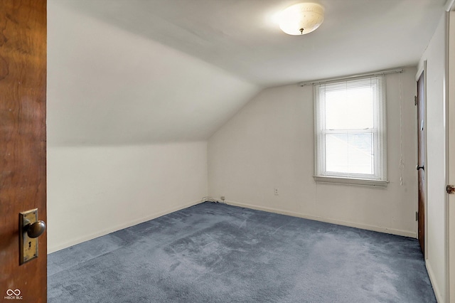 1194 S Faculty Dr, Indianapolis, IN 46241 - additional living space with dark carpet, baseboards, and lofted ceiling