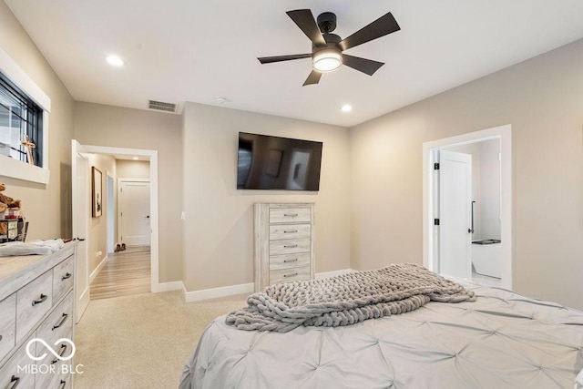 bedroom with light carpet, recessed lighting, visible vents, and baseboards