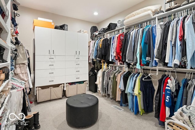 spacious closet with visible vents and light carpet