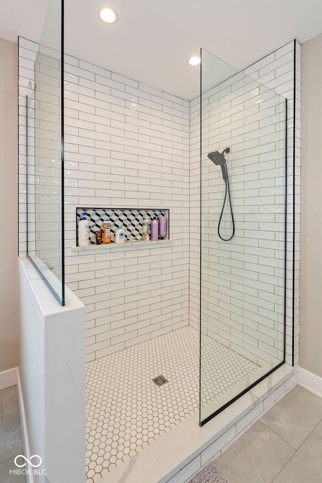 full bathroom with a walk in shower, baseboards, tile patterned flooring, and recessed lighting