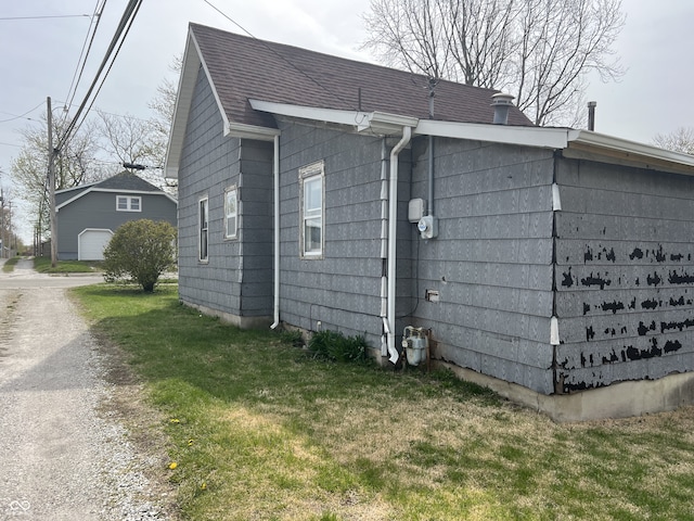 view of home's exterior with a yard