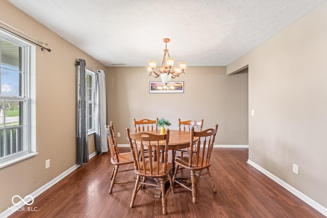 5817 Thompson Park Blvd, Indianapolis, IN 46237 - dining space featuring a wealth of natural light, an inviting chandelier, baseboards, and dark wood-style floors