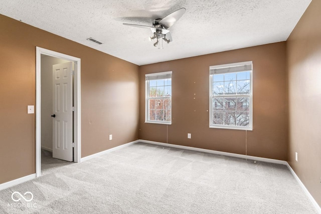 5817 Thompson Park Blvd, Indianapolis, IN 46237 - spare room with light carpet, visible vents, baseboards, and ceiling fan