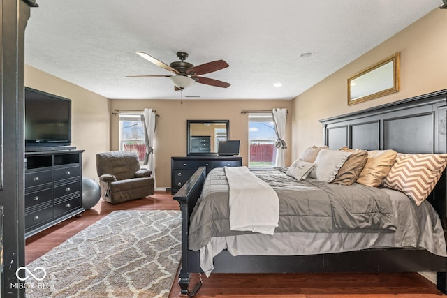 5817 Thompson Park Blvd, Indianapolis, IN 46237 - bedroom featuring multiple windows, a ceiling fan, and wood finished floors