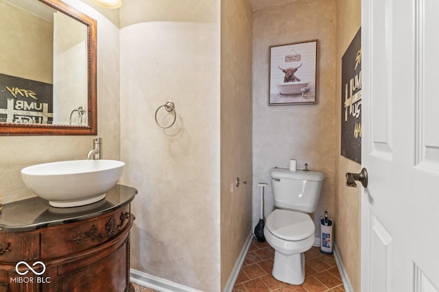 5817 Thompson Park Blvd, Indianapolis, IN 46237 - half bath with tile patterned flooring, vanity, baseboards, and toilet