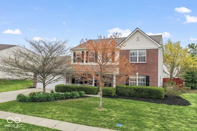 5817 Thompson Park Blvd, Indianapolis, IN 46237 - traditional home with driveway, a front yard, a garage, and brick siding