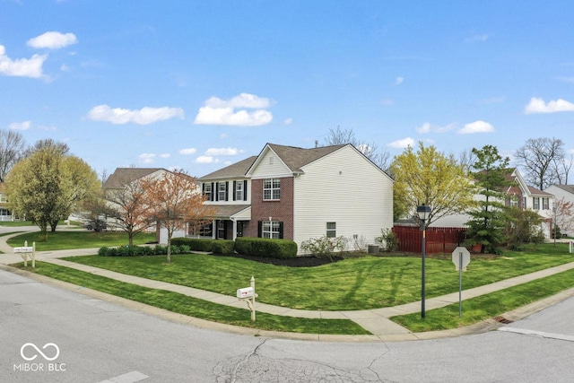 5817 Thompson Park Blvd, Indianapolis, IN 46237 - view of home's exterior with brick siding, fence, and a lawn