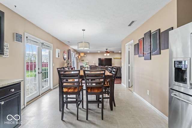 5817 Thompson Park Blvd, Indianapolis, IN 46237 - dining room featuring baseboards, french doors, a textured ceiling, visible vents, and ceiling fan