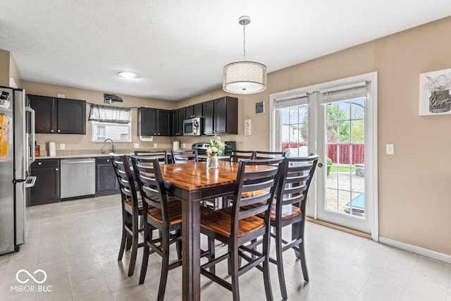 5817 Thompson Park Blvd, Indianapolis, IN 46237 - dining room with baseboards and a wealth of natural light