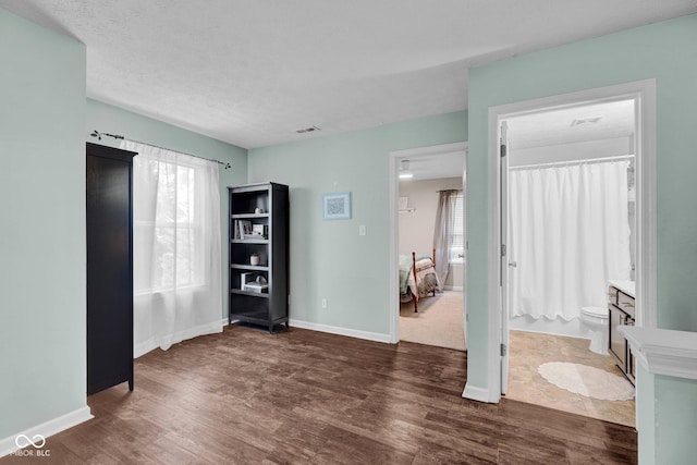 1280 Summer Ridge Ln, Brownsburg, IN 46112 - unfurnished bedroom featuring dark wood-type flooring