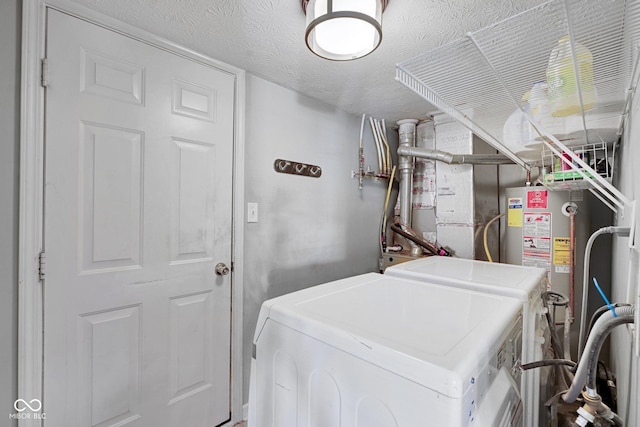 1280 Summer Ridge Ln, Brownsburg, IN 46112 - laundry area with independent washer and dryer, gas water heater, and a textured ceiling