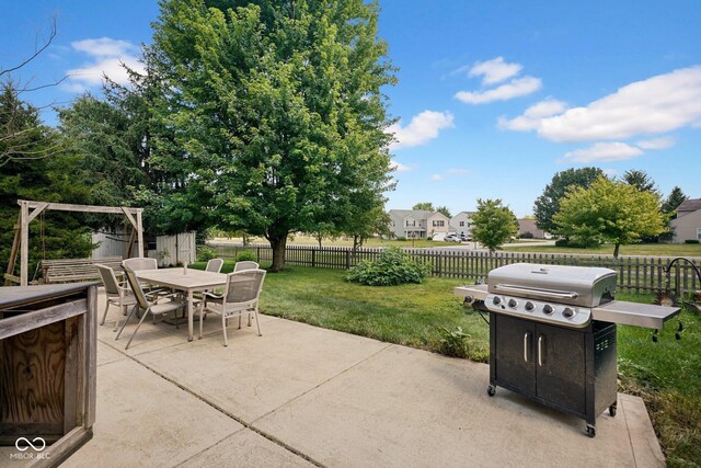1280 Summer Ridge Ln, Brownsburg, IN 46112 - fenced backyard featuring a patio area, grilling area, and outdoor dining area