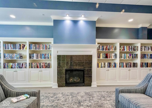 12907 Shiraz Ln, Fishers, IN 46037 - sitting room with crown molding and a fireplace