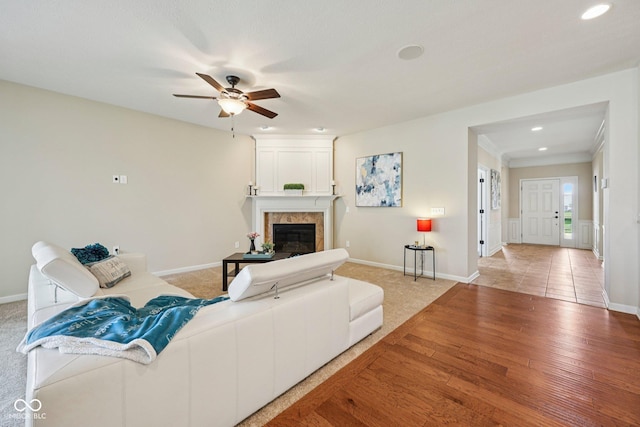 12907 Shiraz Ln, Fishers, IN 46037 - living area featuring recessed lighting, ceiling fan, baseboards, light wood-style floors, and a premium fireplace