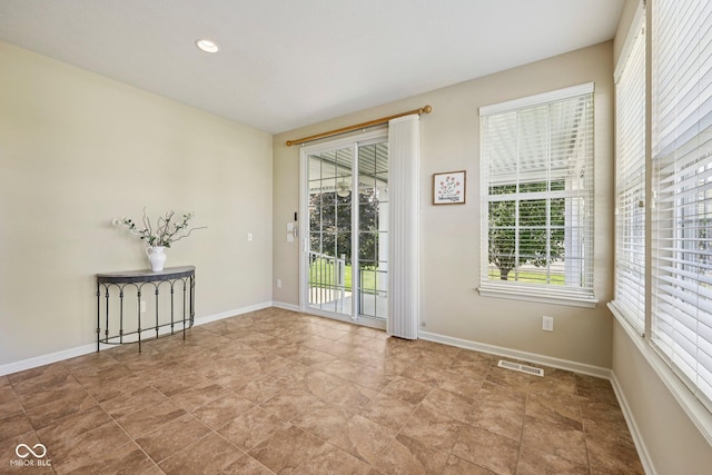 12907 Shiraz Ln, Fishers, IN 46037 - unfurnished room featuring healthy amount of natural light and baseboards