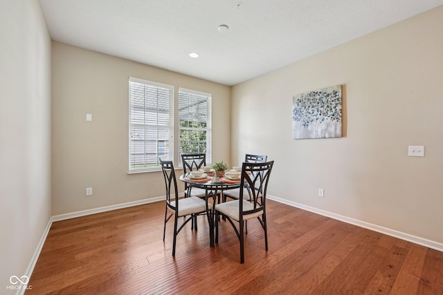 12907 Shiraz Ln, Fishers, IN 46037 - dining room featuring baseboards, wood finished floors, and recessed lighting