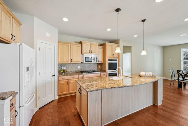 12907 Shiraz Ln, Fishers, IN 46037 - kitchen with white appliances, light brown cabinetry, a sink, dark wood-style floors, and recessed lighting