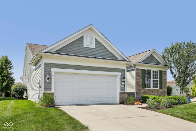 12907 Shiraz Ln, Fishers, IN 46037 - ranch-style house with brick siding, driveway, a front lawn, and a garage