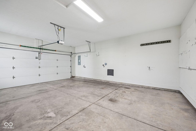 12907 Shiraz Ln, Fishers, IN 46037 - garage featuring a garage door opener and electric panel