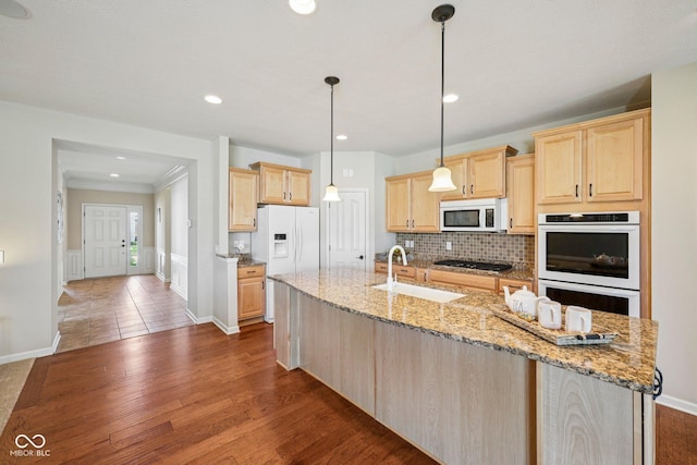 12907 Shiraz Ln, Fishers, IN 46037 - kitchen with white appliances, a sink, light brown cabinets, dark wood-style flooring, and a spacious island