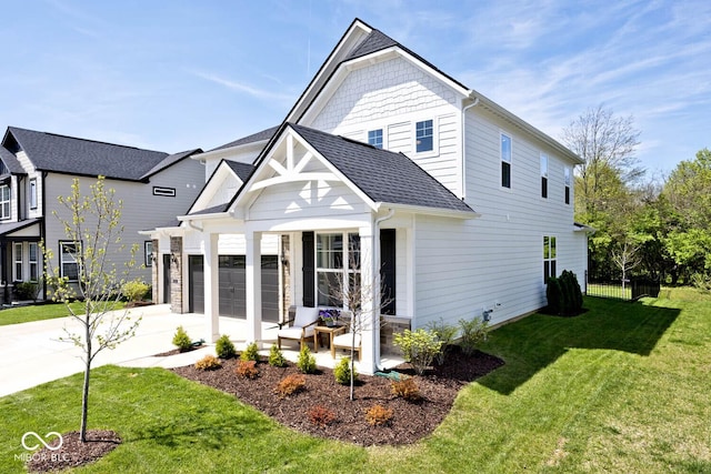 exterior space featuring an attached garage, a lawn, a shingled roof, and driveway