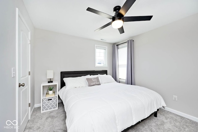bedroom featuring baseboards, carpet floors, and ceiling fan