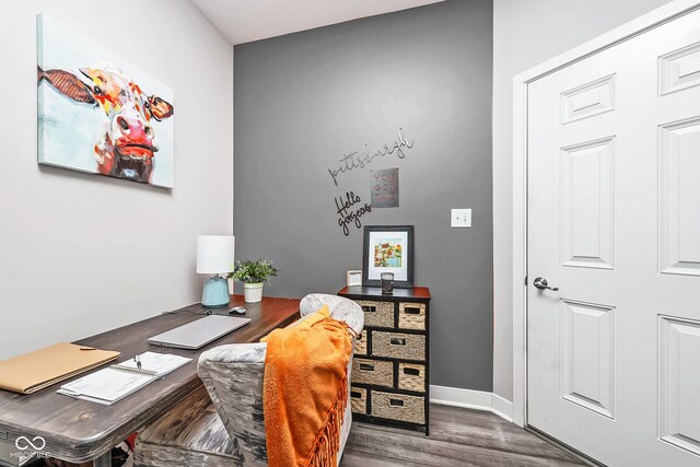 office area with wood finished floors and baseboards