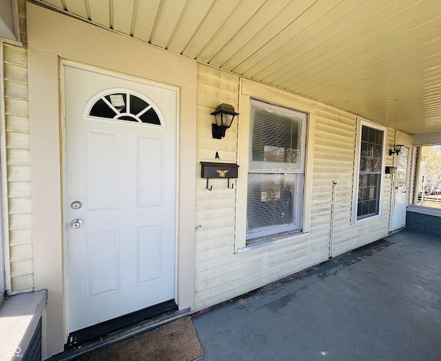 doorway to property featuring a porch
