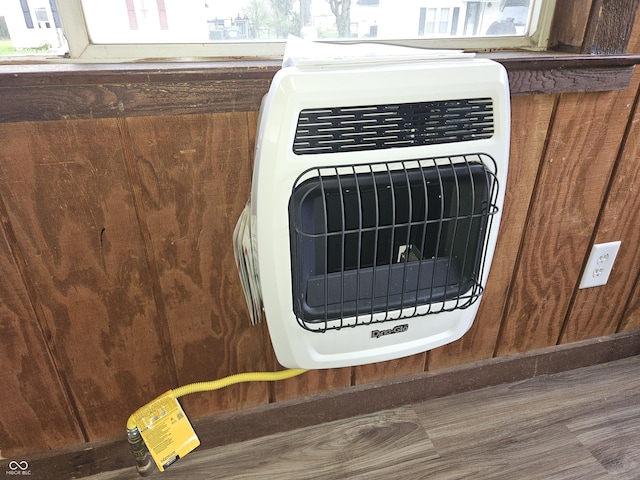 details with wooden walls and heating unit