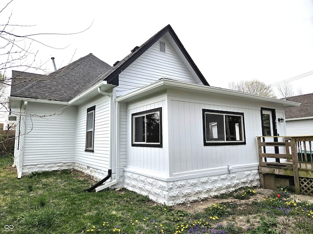 view of home's exterior with a lawn