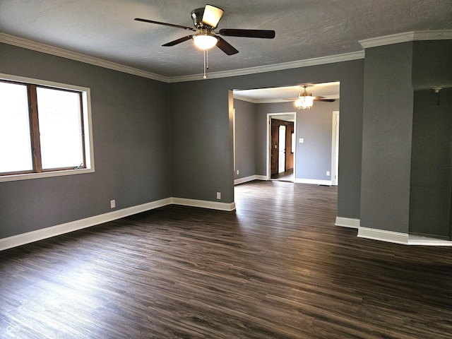 spare room with a textured ceiling, dark wood-style flooring, baseboards, and a ceiling fan