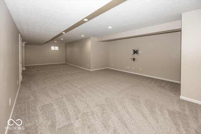 11648 Stickney Ct, Fishers, IN 46037 - below grade area featuring carpet floors, a textured ceiling, baseboards, and recessed lighting
