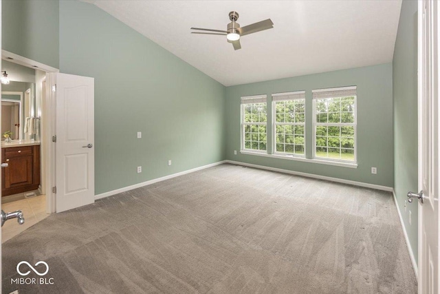 11648 Stickney Ct, Fishers, IN 46037 - unfurnished bedroom with light colored carpet, baseboards, connected bathroom, and high vaulted ceiling
