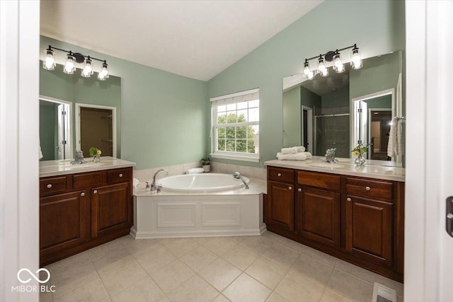 11648 Stickney Ct, Fishers, IN 46037 - full bath featuring lofted ceiling, two vanities, a stall shower, a bath, and tile patterned flooring