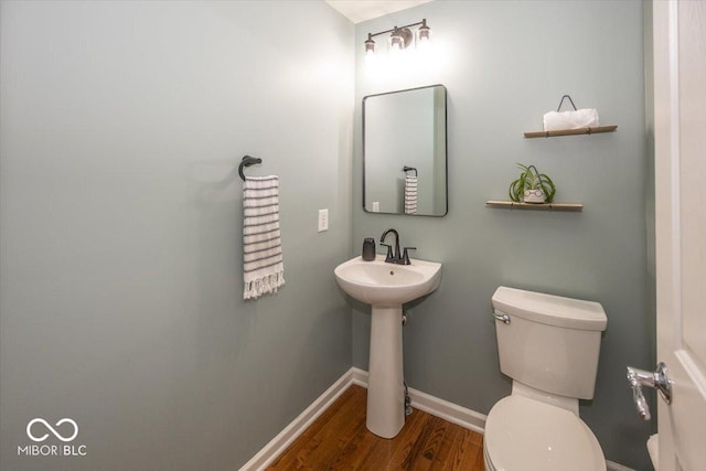 11648 Stickney Ct, Fishers, IN 46037 - bathroom featuring toilet, wood finished floors, baseboards, and a sink