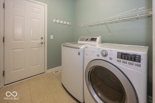 11648 Stickney Ct, Fishers, IN 46037 - laundry area featuring independent washer and dryer and baseboards
