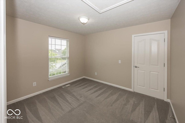 11648 Stickney Ct, Fishers, IN 46037 - empty room featuring baseboards, carpet flooring, and a textured ceiling