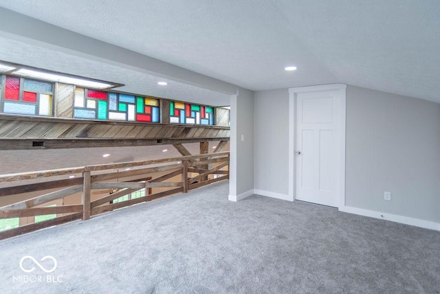 bonus room with recessed lighting, baseboards, and carpet