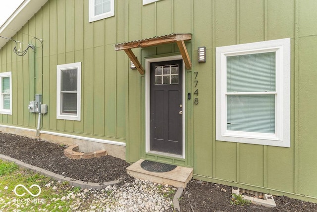 property entrance with board and batten siding
