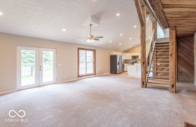 7748 S State Road 39, Clayton, IN 46118 - unfurnished living room featuring recessed lighting, light carpet, baseboards, vaulted ceiling, and stairs
