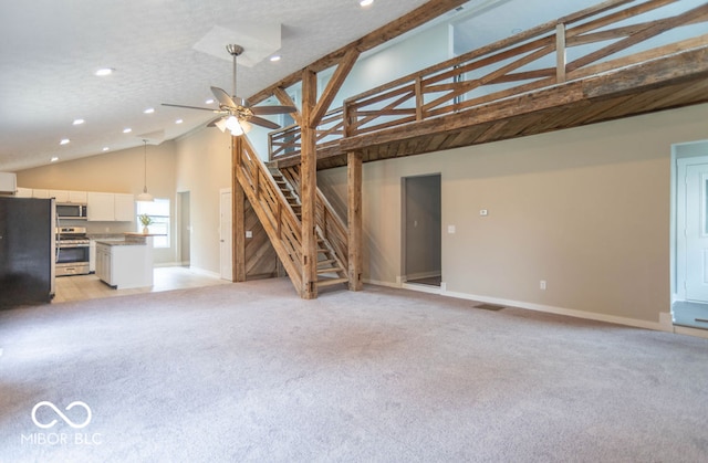 7748 S State Road 39, Clayton, IN 46118 - unfurnished living room with light colored carpet, recessed lighting, baseboards, and high vaulted ceiling