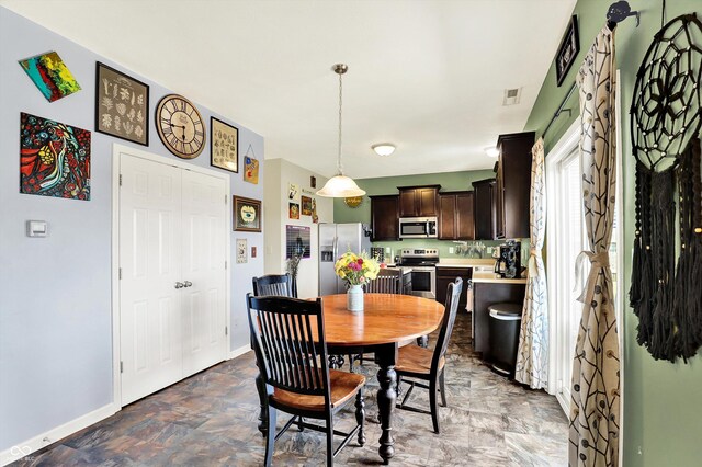 950 Redwood Dr, Franklin, IN 46131 - dining room featuring baseboards and stone finish flooring